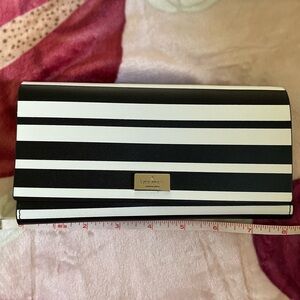 Never used Kate Spade leather flip wallet with gold accents.